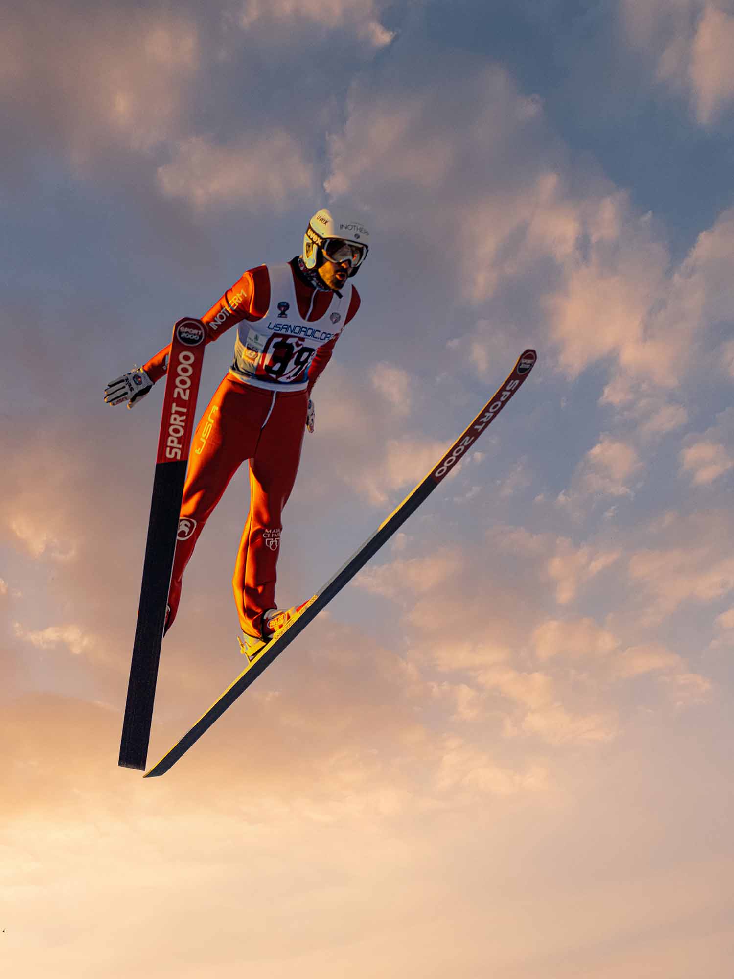 a person in a ski suit jumping in the air